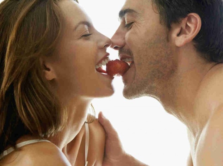 couple eating strawberries